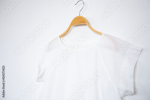 blouse is on clothes-hanger on white background.close up.