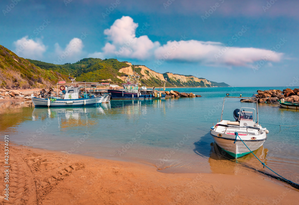 Beautiful spring scenery. Amazing morning view of small port in Gardenos village. Bright spring seascape of Ionian Sea. Picturesque landscape of Corfu island, Greece, Europe.