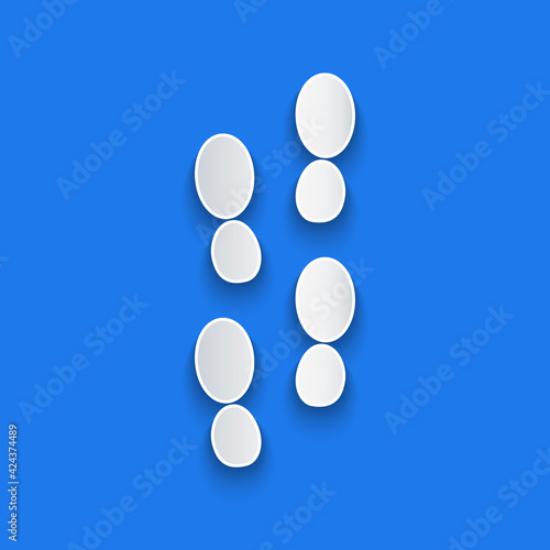 Paper cut Human footprints shoes icon isolated on blue background. Shoes sole. Paper art style. Vector