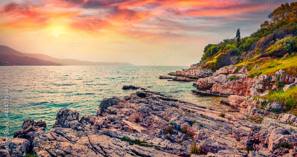 Beautiful marine scenery. Marvelous summer sunset on empty Paralia Pipitos Beach. Fabulous evening seascape of Ionian Sea. Spectacular landscape of Corfu island, Greece, Europe.
