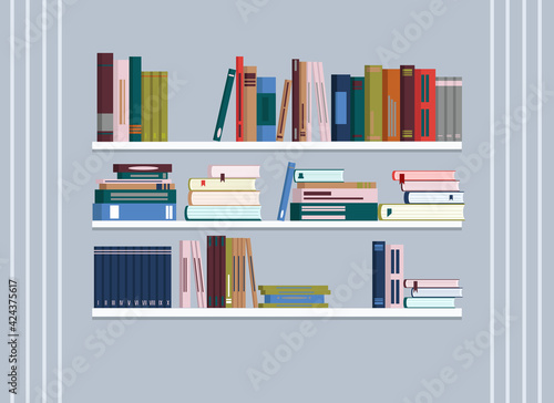 There are bookshelves on the wall with lots of books.