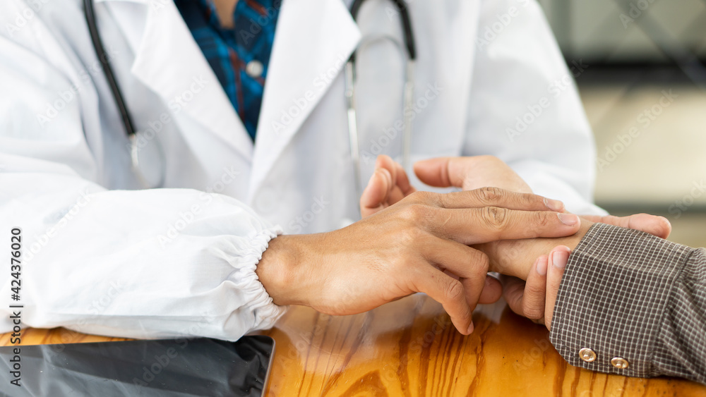 The doctor examines the pulse of mental health care concept by consulting a doctor in a health check-up clinic or hospital. The doctor examines the pulse of mental health care concept by consulting a doctor in a health check-up clinic or hospital.