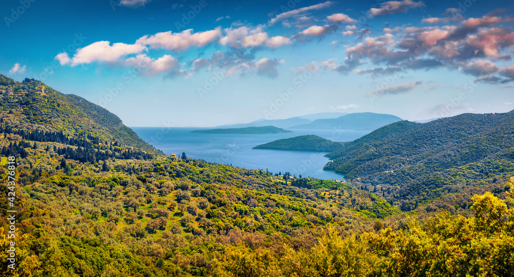 Beautiful summer scenery. Panoramic morning view of Vasiliki town valley, Lefkada, Greece, Europe. Colorful morning seascape of Ionian Sea. Traveling concept background.
