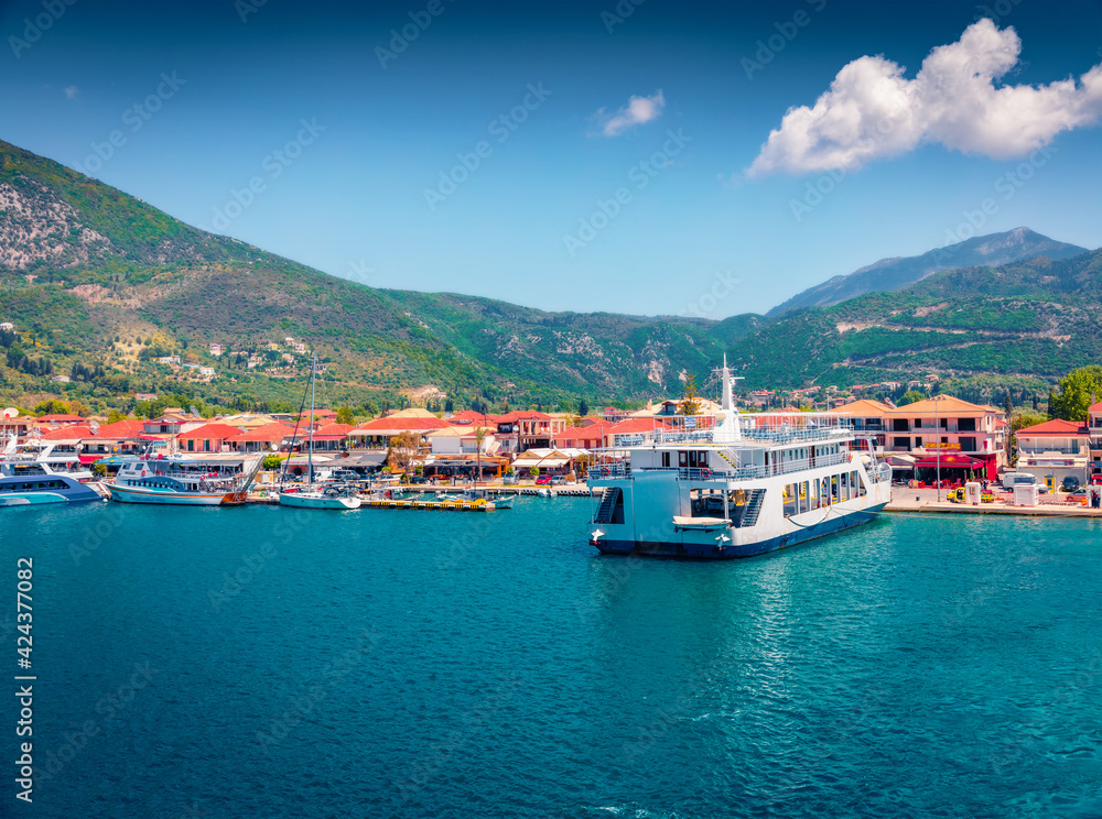 Attractive summer cityscape of Nydri port. Wonderful morning seascape of Ionian Sea. Spectacular outdoor scene of Lefkada island, Greece, Europe. Traveling concept background.