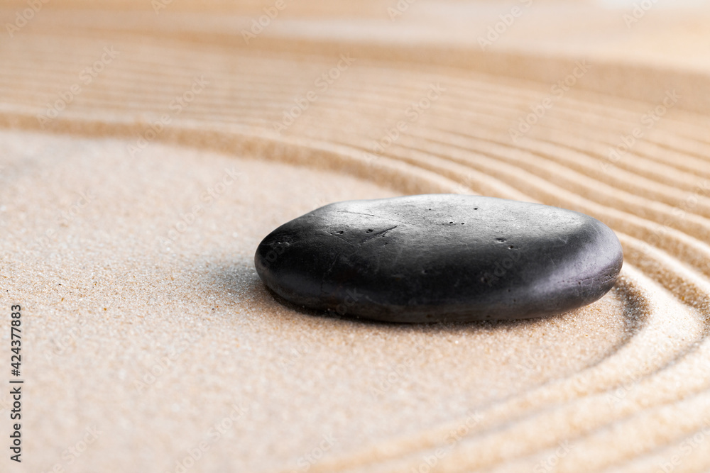 Fototapeta premium Japanese zen garden with stone in raked sand