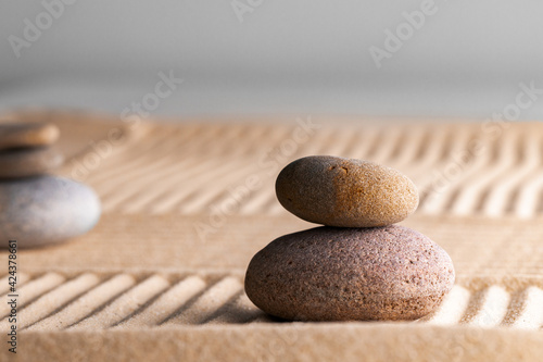 Japanese zen garden with stone in raked sand