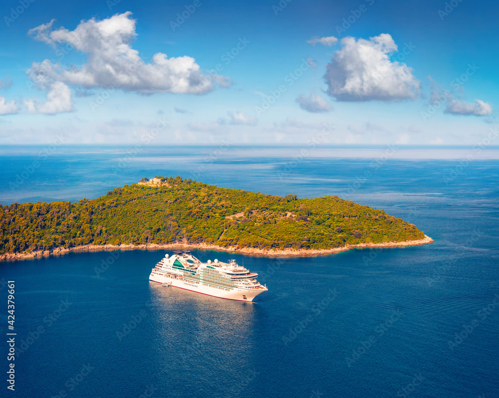 Beautiful marine scenery. Colorful summer seascape of Adriatic sea. Aerial morning view of cruise liner and Lokrum island from Dubrava Observation Point, Croatia, Europe.