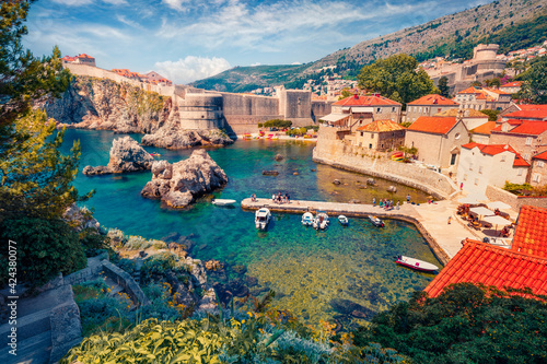 Сharm of the ancient cities of Europe. Aerial mornig view of Old Town from Fort Bokar. Picturesque summer cityscape of Dubrovnik. Sunny seascape of Adriatic sea, Croatia, Europe. #424380077