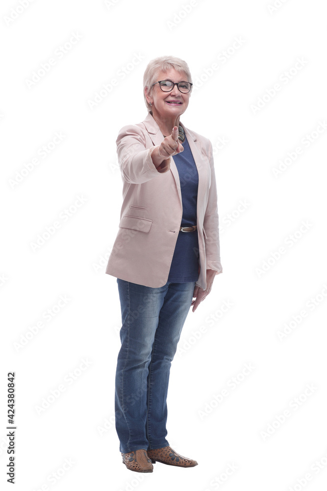 in full growth. smiling elderly lady pointing at you. in full growth. smiling elderly lady pointing at you.