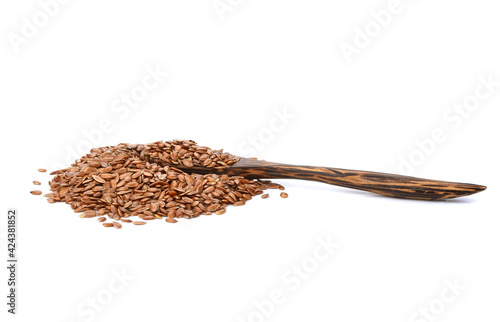 Flax seeds in a wooden spoon isolated on white background.