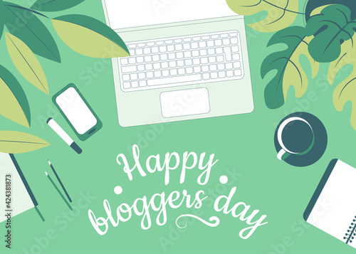 Happy blogger day. Work desk with laptop, mobile phone and work accessories among green foliage. Top view. Flat vector