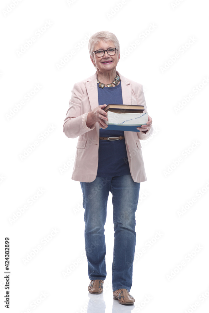 in full growth. senior woman with a stack of books in full growth. senior woman with a stack of books