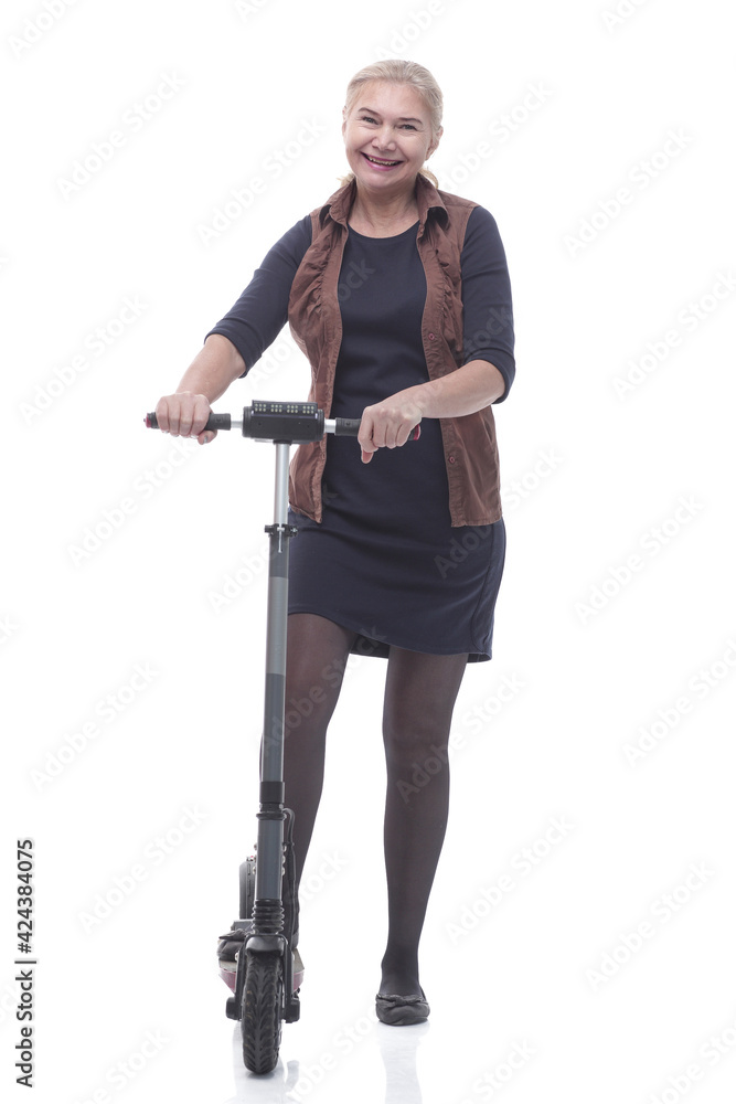 in full growth. happy woman with a comfortable electric scooter in full growth. happy woman with a comfortable electric scooter