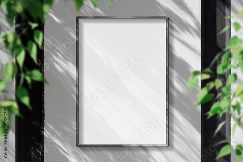 Metal frame hanging in street mockup. Template of a picture framed on a wall bathed in sunlight 3D rendering