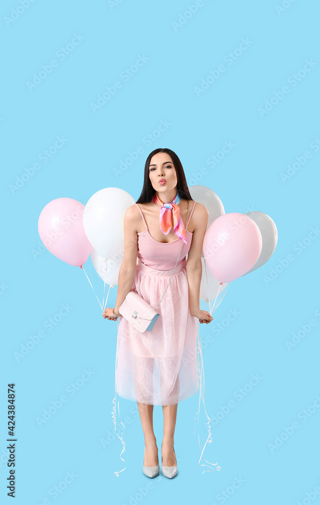 Beautiful young woman with balloons on color background Beautiful young woman with balloons on color background