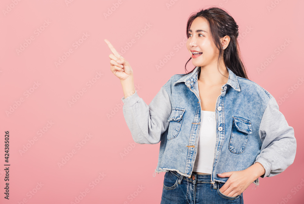 woman standing smiling indicate finger empty space woman standing smiling indicate finger empty space