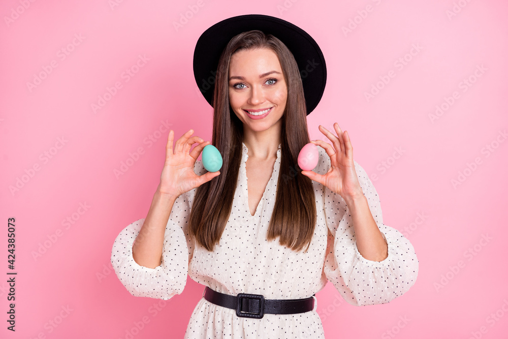 Photo of sweet pretty young lady wear white outfit cap holding easter eggs isolated pink color background Photo of sweet pretty young lady wear white outfit cap holding easter eggs isolated pink color background