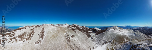 Wallpaper Mural 180 degree aerial drone shooting of the Madonie Mountains in winter. Skiing at Piano Battaglia during the winter. Snow in Sicily. Madonie Park. La Mufara with the ski slopes. Winter tourism in Sicily. Torontodigital.ca