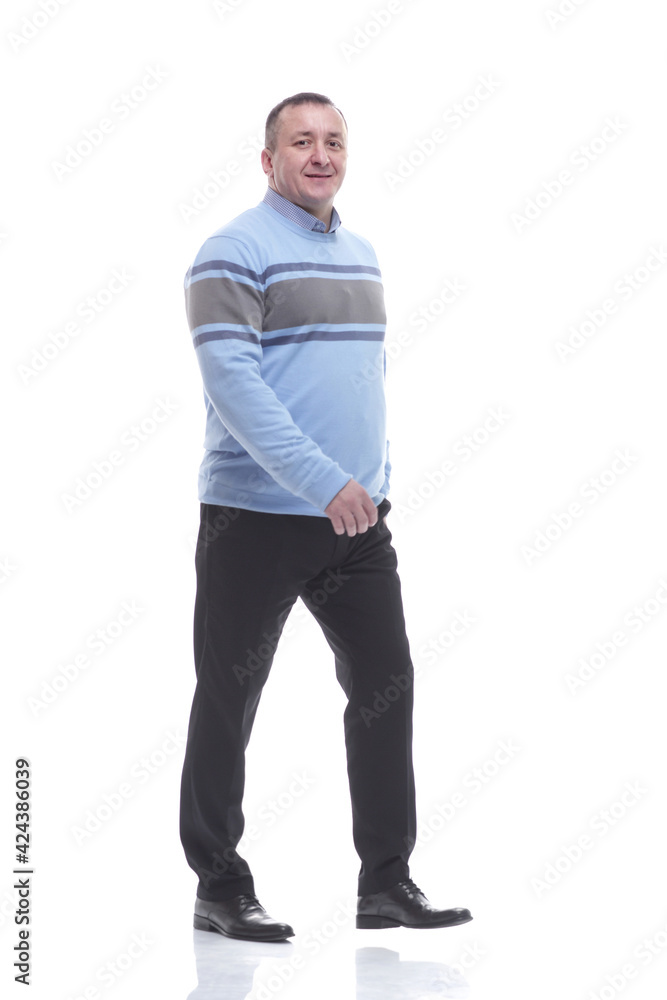 side view. a serious man in a sweater walks forward side view. a serious man in a sweater walks forward