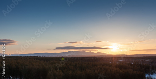 beautiful sky with clouds and the setting sun behind the mountains, sunset, sunrise, landscape, forest © Евгения Немчинова