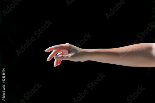 The girl's hands show various gestures on black background