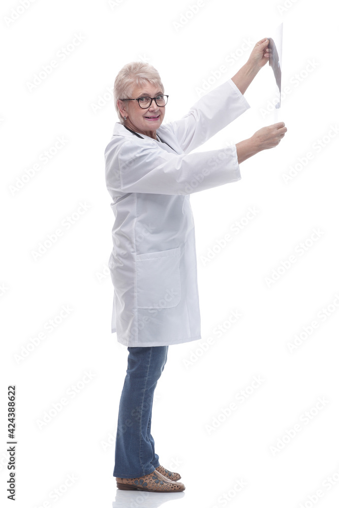 in full growth. female doctor looking at an x- ray of a patient in full growth. female doctor looking at an x- ray of a patient