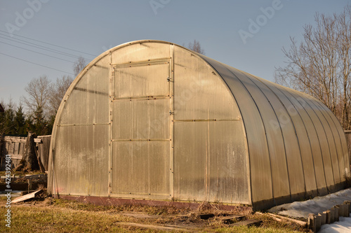 polycarbonate greenhouse in early spring