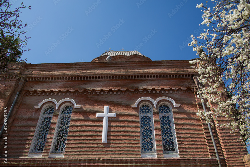 Naklejka premium Orthodox church brick wall with cross
