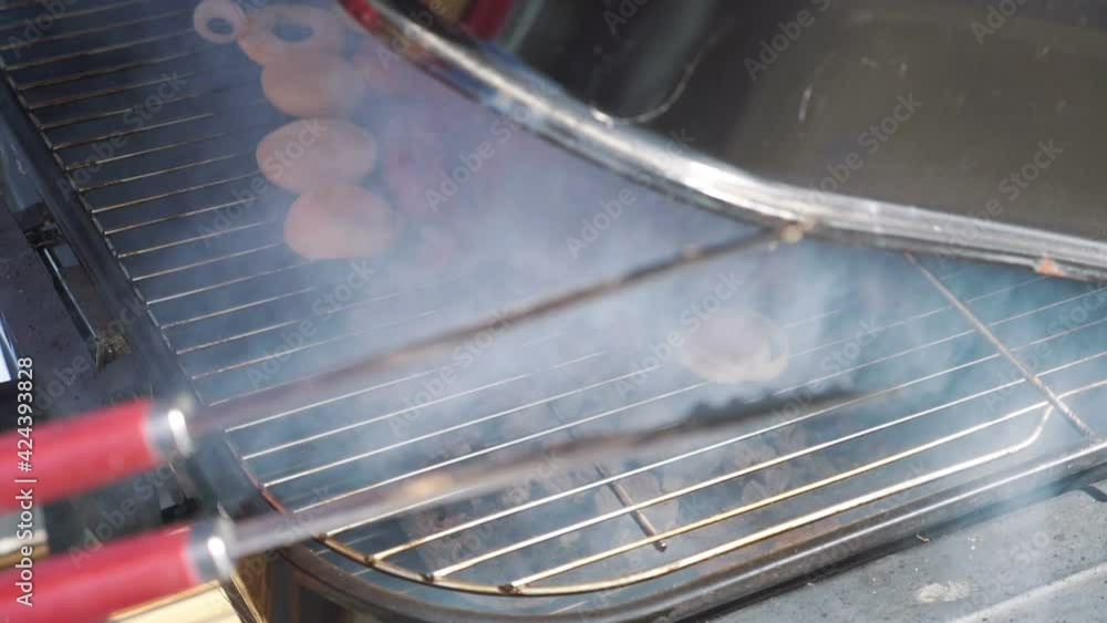 Opening grill and showing delicious roasted meat in slow motion 180fps
Opening grill and showing delicious roasted meat in slow motion 180fps