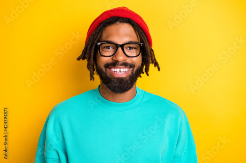 Photo of young african cheerful man happy positive toothy smile isolated over yellow color background
