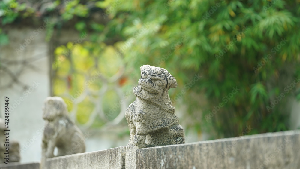 The old stone sculpture view located in the old and classical Chinese garden