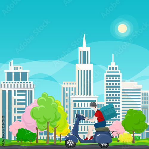 Young guy in protective face mask with box for food delivery rides a blue scooter on a spring background of colorful trees and cities, online delivery service and stay home concept
