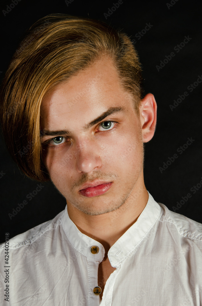 Portrait of a young attractive guy with blue eyes. Portrait of a young attractive guy with blue eyes.