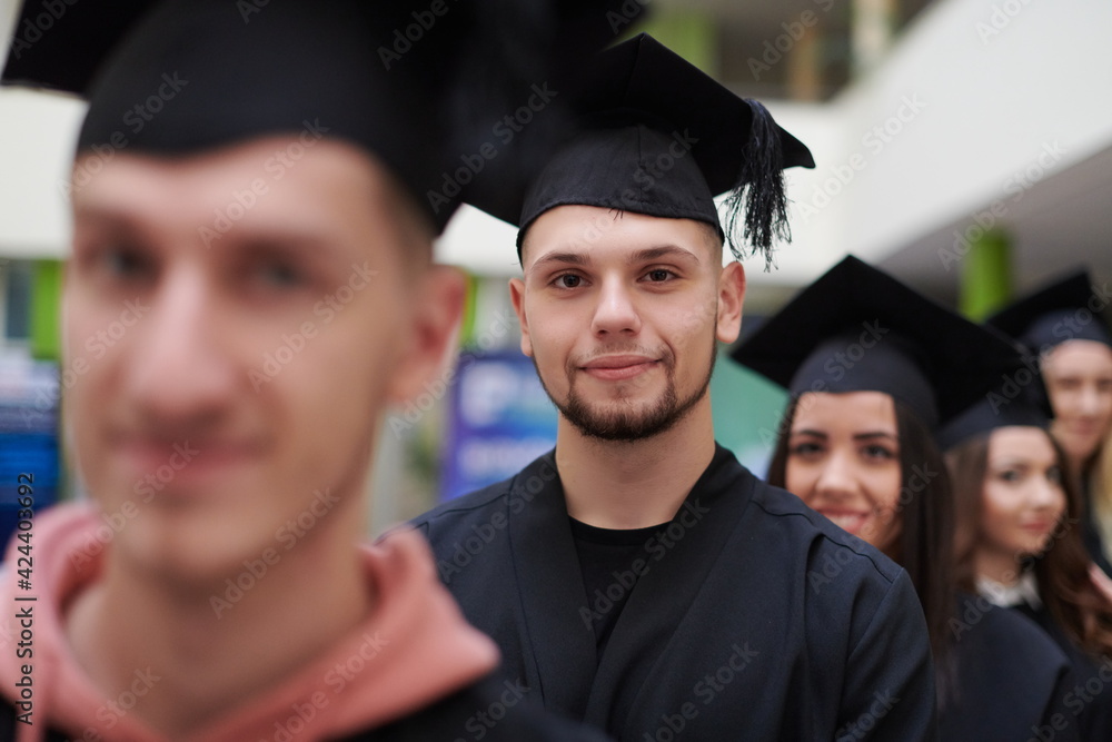 Fototapeta premium Group of diverse international graduating students celebrating