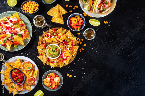 Mexican food overhead flat lay shot on a black slate background