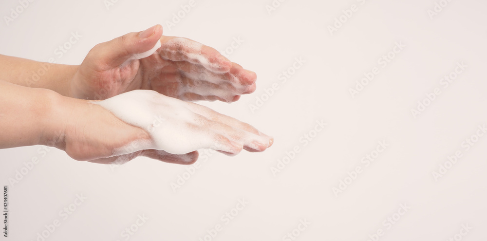 Hands washing gesture with foaming hand soap on white background. Hands washing gesture with foaming hand soap on white background.