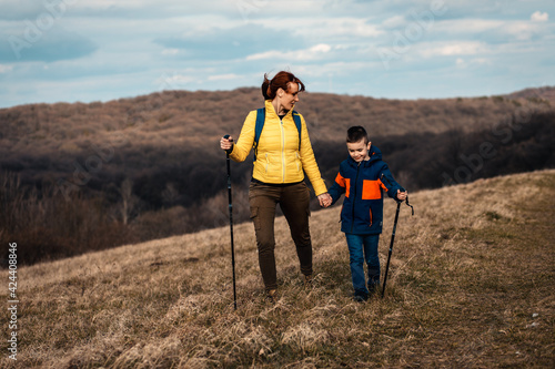 Mother and son hiking together in the mountains. © Zoran Zeremski