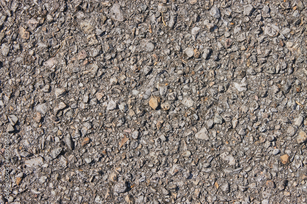 Zoom View Gravel or Pebble on Asphalt Road Texture Background in Natural Light Zoom View Gravel or Pebble on Asphalt Road Texture Background in Natural Light