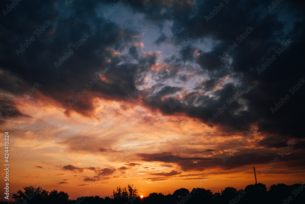 Fototapeta premium beautiful bright sunset, expressive blue-orange sky. Evening time