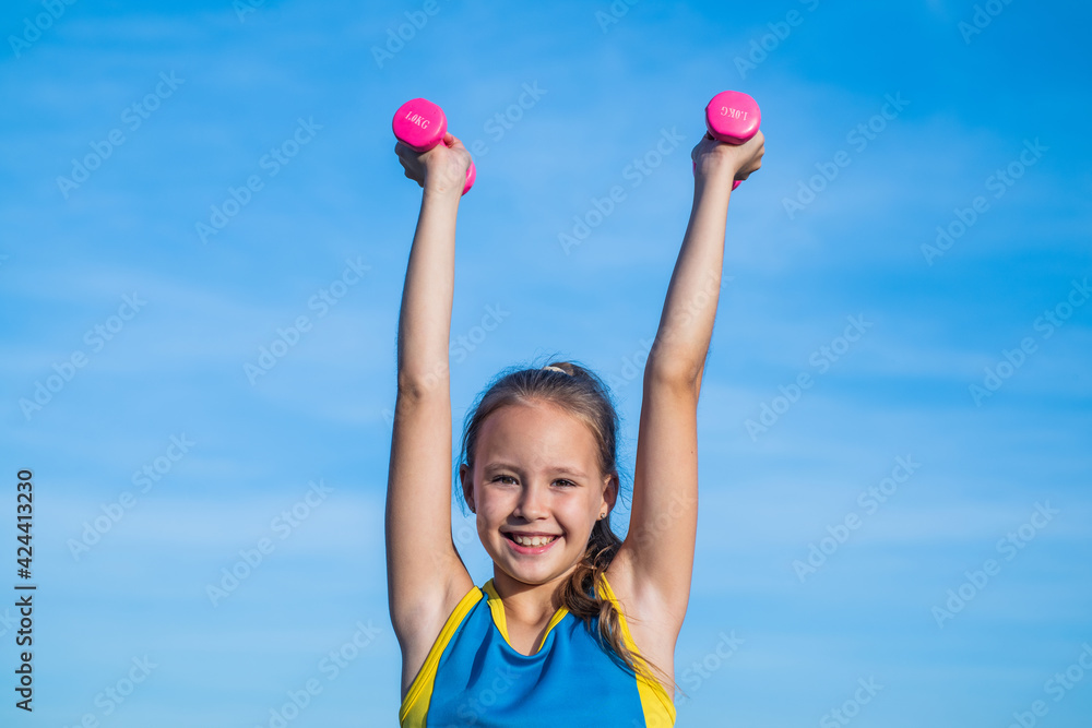 aim and success. healthy child training with barbells. fitness kid hold dumbbell. weight lifting. teenage girl do exercise. happy childhood. future of sport. warm up for workout in morning aim and success. healthy child training with barbells. fitness kid hold dumbbell. weight lifting. teenage girl do exercise. happy childhood. future of sport. warm up for workout in morning