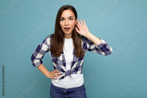 Closeup photo of beautiful attractive shocked amazed surprised young woman with open mouth wearing casual clothes isolated over colourful background with empty space