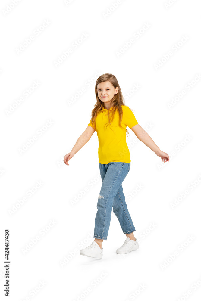 Happy kid, girl isolated on white studio background. Looks happy, cheerful, sincere. Copyspace. Childhood, education, emotions concept Happy kid, girl isolated on white studio background. Looks happy, cheerful, sincere. Copyspace. Childhood, education, emotions concept