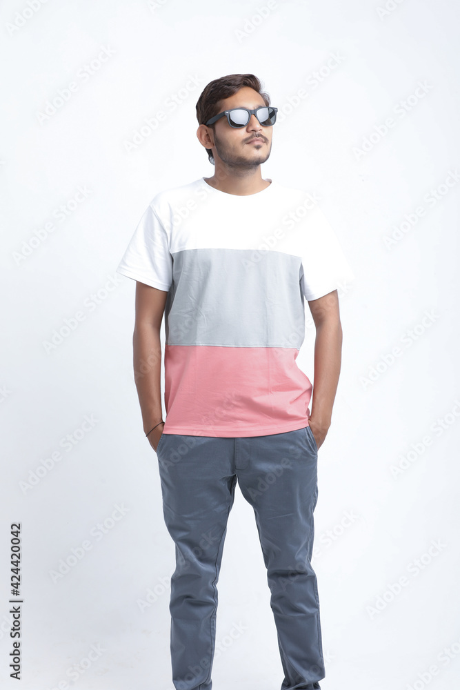 Young handsome indian college student giving expression on white background. Young handsome indian college student giving expression on white background.