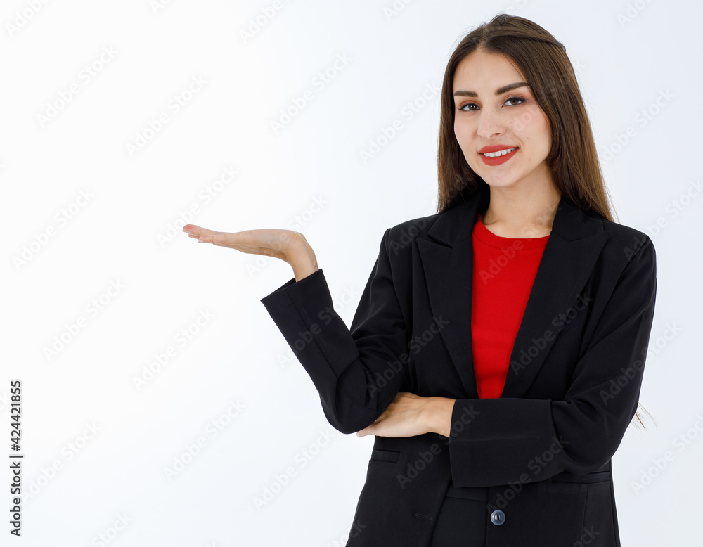 Portrait of cute caucasian mature businesswoman wearing black office suit standing and shows hand palm in presenting and demonstrate pose. Success working concept isolated on white background Portrait of cute caucasian mature businesswoman wearing black office suit standing and shows hand palm in presenting and demonstrate pose. Success working concept isolated on white background