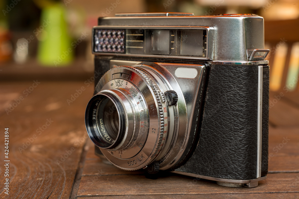 Old analog camera with lens