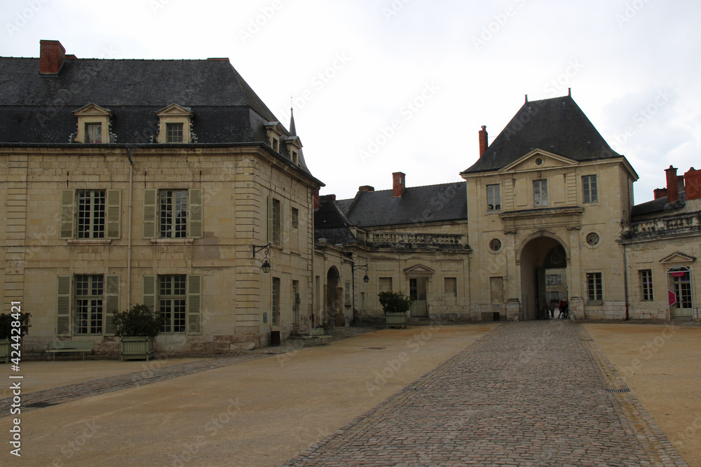 gate and buildings at the fontevraud abbey in france