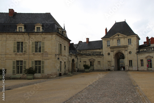 gate and buildings at the fontevraud abbey in france