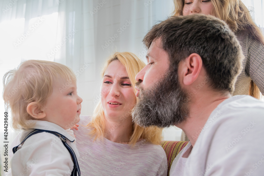 Dad with children congratulate mom on the holiday, mother's day. Dad with children congratulate mom on the holiday, mother's day.