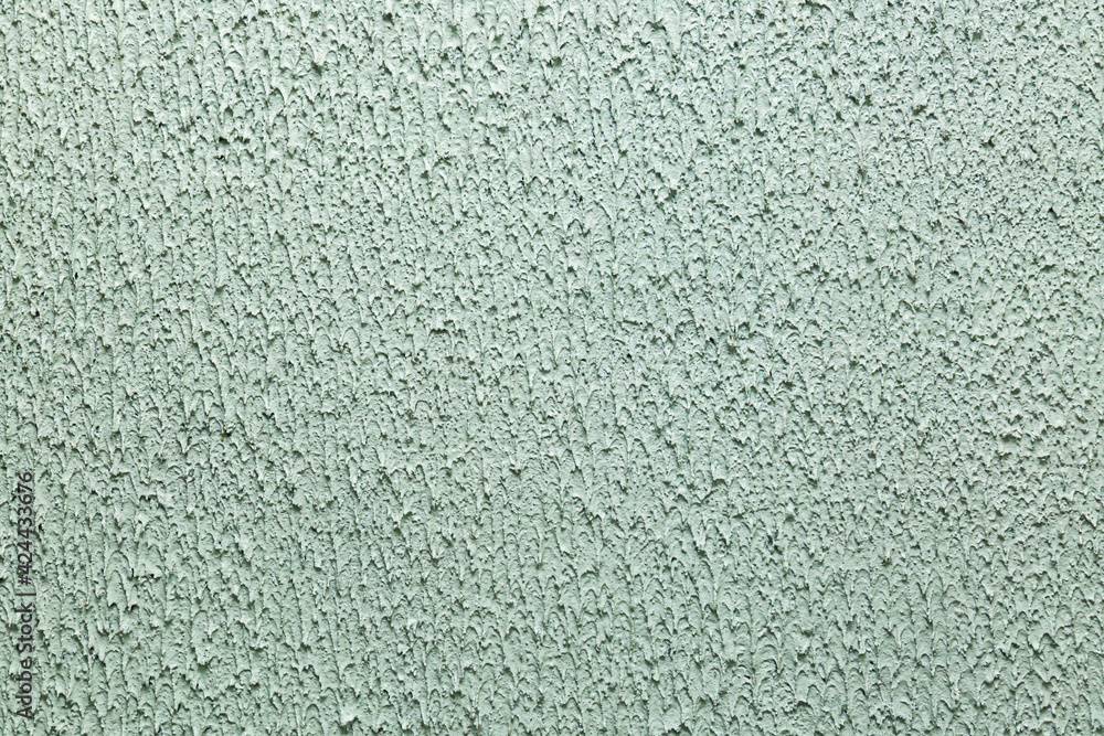 Modern pattern of light green decorative plaster.Trendy abstract background. Texture for design and decoration with copy space. Modern pattern of light green decorative plaster.Trendy abstract background. Texture for design and decoration with copy space.