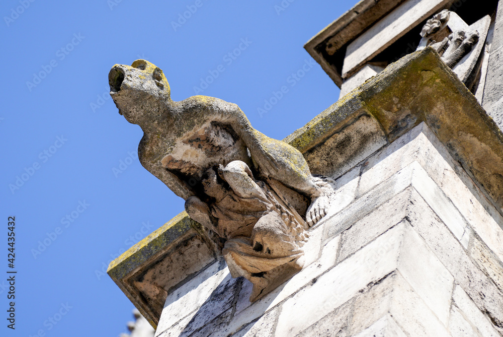 Lime sandstone gargoyles at St. Peter's Cathedral in Regensburg, photographed in spring